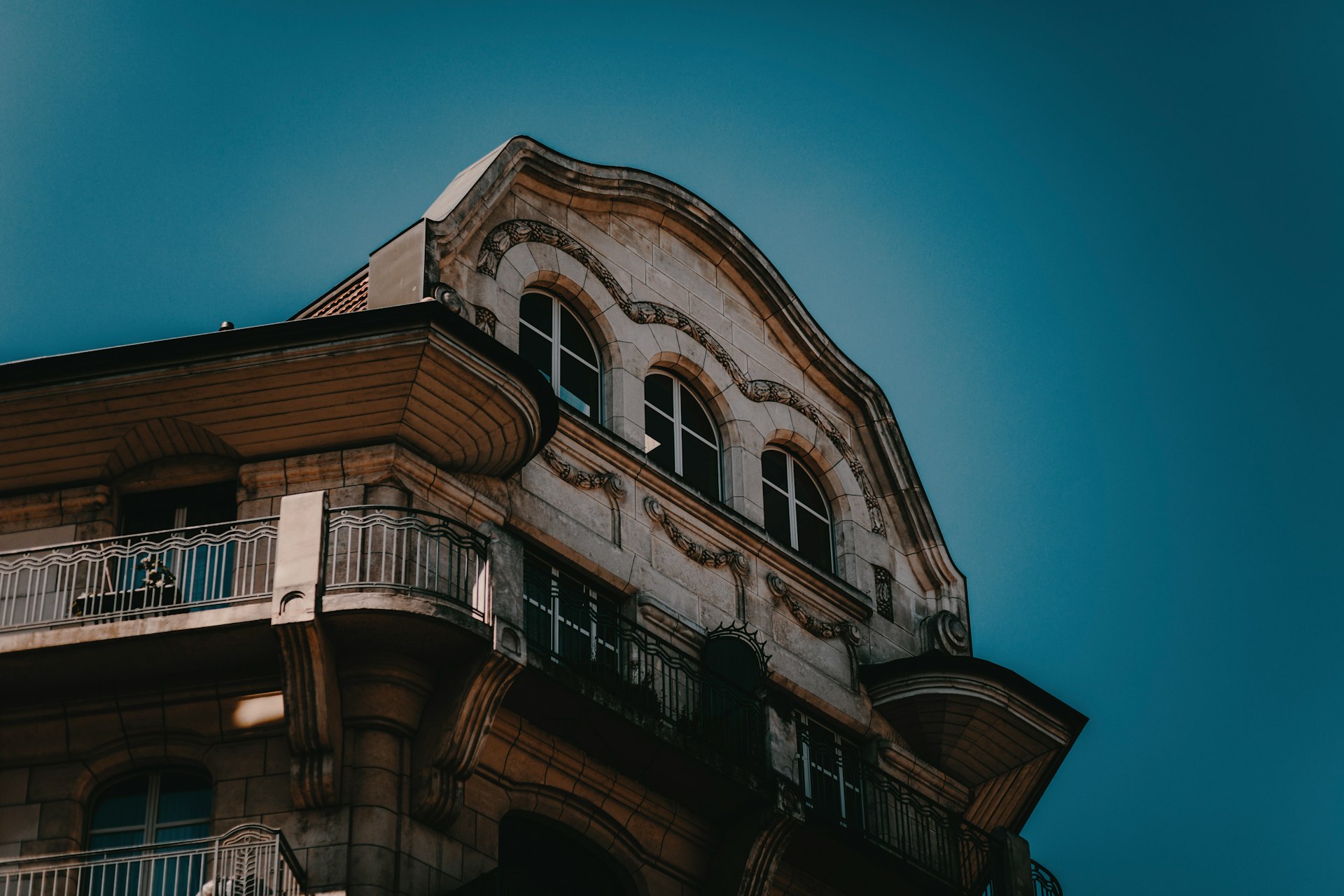low angle photography of brown and white high-rise building